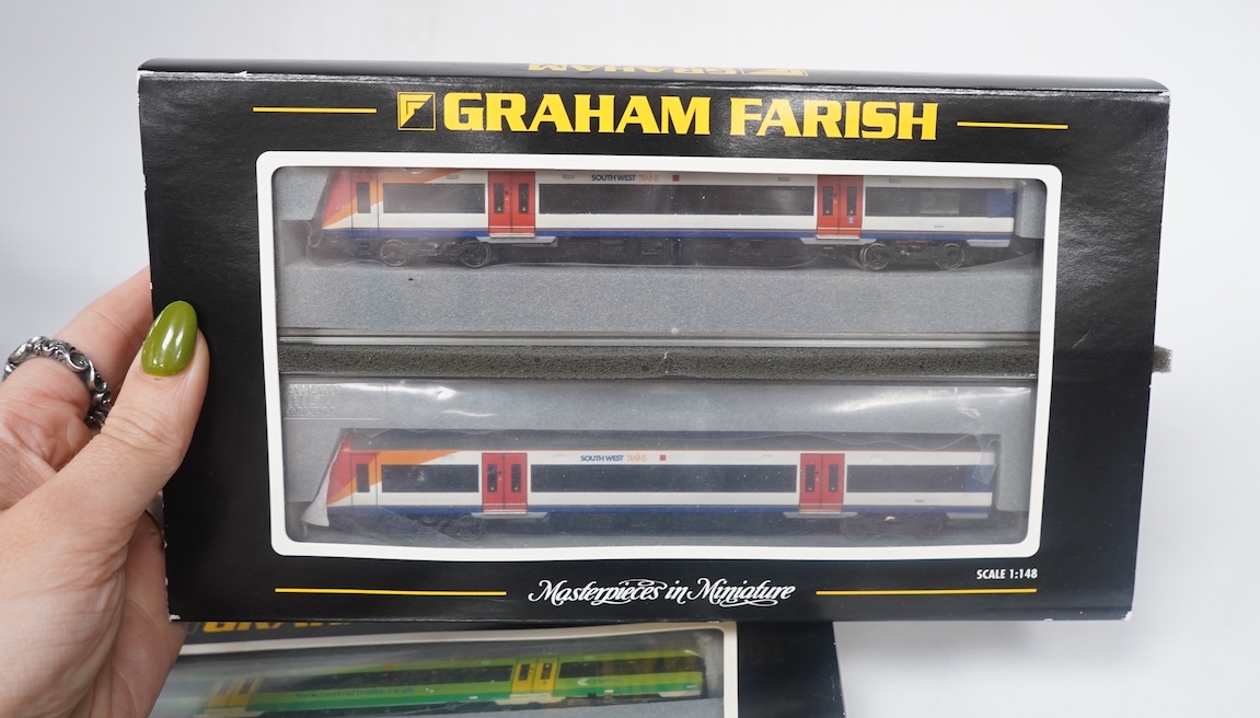Three boxed Graham Farish N gauge railway DMU train packs; a South West Trains 170/4 2-car DMU (371-427), a Midland Mainline 170/1 Turbostar 2-car DMU (371-425), and a Central Trains Turbostar 170/5 2-car DMU (371-426).